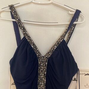 Women’s navy blue dress with beaded straps and neckline
